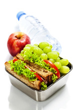 Lunch Box With Sandwiches And Fruits