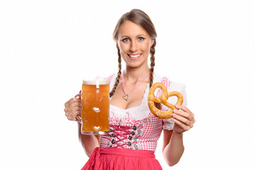 Wall Mural - Lächelnde Frau im Dirndl mit einem Bier und Brezel