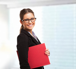 Canvas Print - Businesswoman holding a clipboard