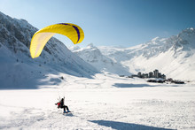 Paraglider Landing On Skis In Tignes, French Alps