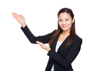 Wall Mural - Asian business woman with hand presentation