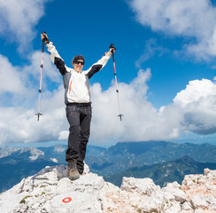 Female climber celebrating a successful ascend