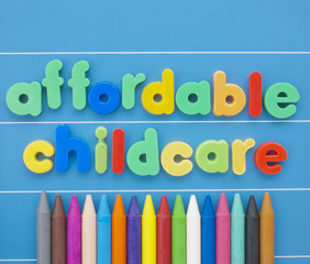 Magnetic letters spelling Affordable Childcare on a blue board.