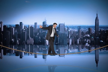 Composite image of mature businessman doing a balancing act on t