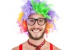© WavebreakMediaMicro - Geeky hipster in afro rainbow wig