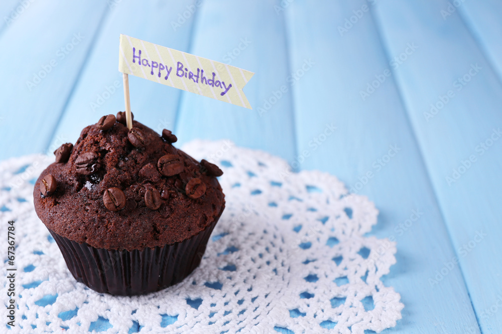 Chocolate muffin on wooden background