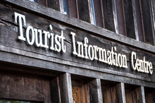 Close Up Of Sign For Tourist Information Centre
