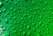 Green Water Drops On The Surface