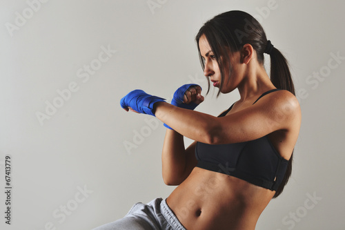fitness woman with the blue boxing bandages, studio shot Fototapete