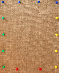 Burlap background with the pins as a frame