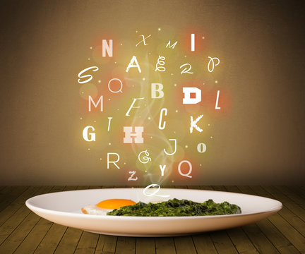 Fresh cook food with colorful letters on wood