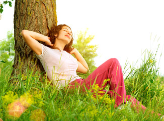 Wall Mural - beautiful young woman outdoors enjoying nature