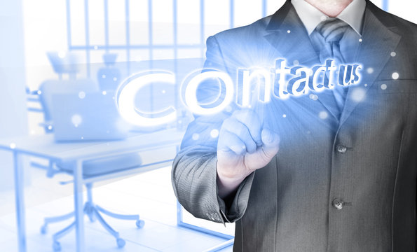 Businessman pushing CONTACT US sign