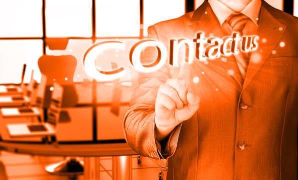 Businessman pushing CONTACT US sign