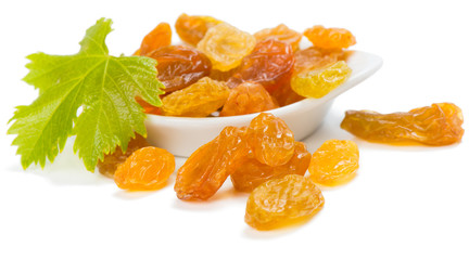 Wall Mural - Yellow raisins or sultanas in a small white ceramic bowl