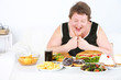 Fat man has a big lunch, on home interior background