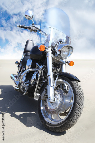 Naklejka na szybę motorcycle on asphalt against sky