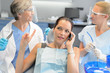 © CandyBox Images - Busy businesswoman at dental surgery on phone