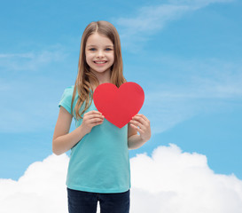 Canvas Print - smiling little girl with red heart