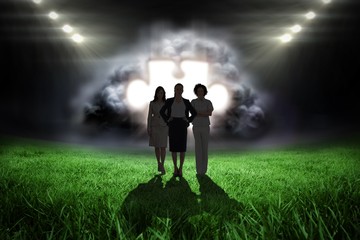 Poster - Composite image of team of businesswomen looking at camera