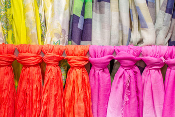 colored scarves tied like a tie