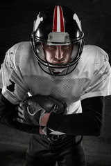 american football player on dark background