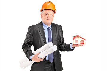 Sticker - Mature architect holding plans and a model house