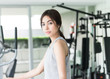 © siraphol - Woman workout at fitness