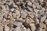 Fototapeta Desenie - Background of small brown rocks. Shallow DOF