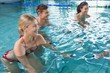 © WavebreakMediaMicro - Fitness class doing aqua aerobics on exercise bikes