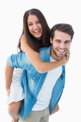 Poster - Happy hipster giving his girlfriend a piggy back