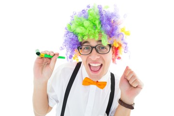 Poster - Geeky hipster wearing a rainbow wig holding party horn