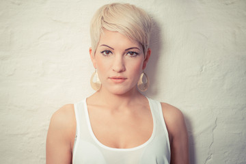 portrait of a young woman with short blond hair