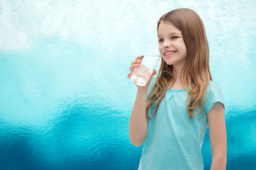 Poster - smiling little girl with glass of water