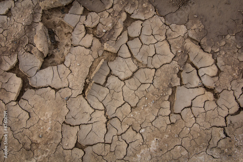 Fotografía Cracked soil texture background