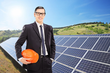 Wall Mural - Construction worker in front of solar panels