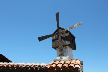 Old windmill on the roof of ancient house, Sozopol, Bulgaria