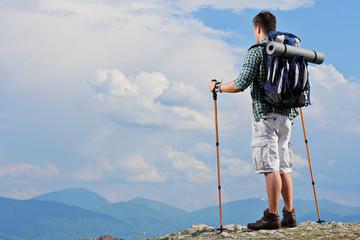 Male hiker standing on a mountain top