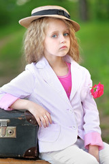 Wall Mural - portrait of little girl outdoors in summer