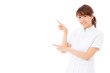 © taka - young asian nurse on white background