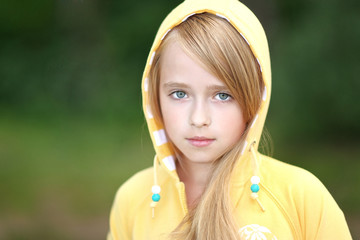 portrait of little girl outdoors in summer