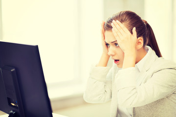 Wall Mural - stressed student with computer in office