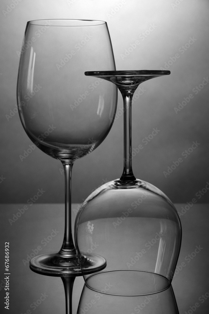 Empty wine glasses arranged on grey background