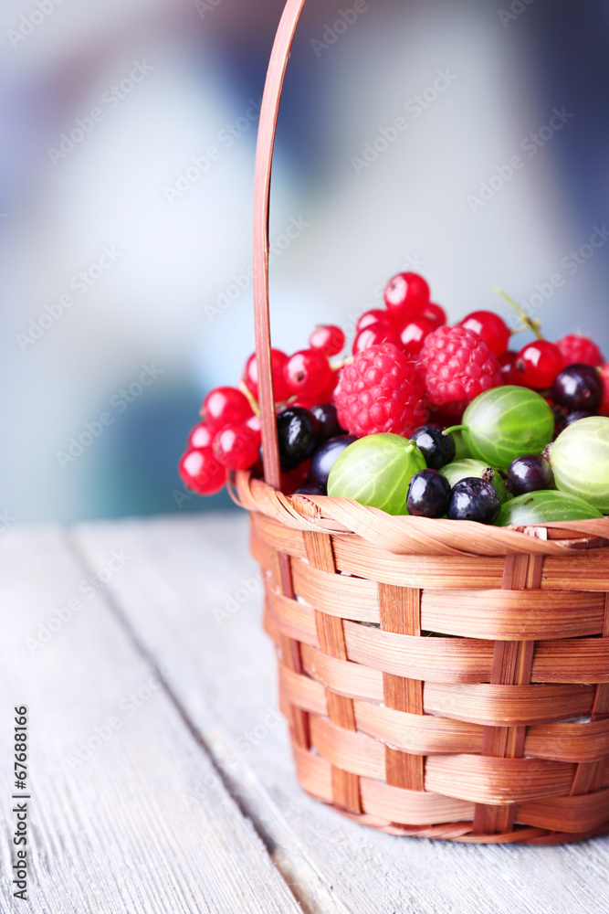 Forest berries in wicker basket,