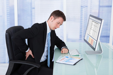 Poster - Businessman Suffering From Backache At Computer Desk