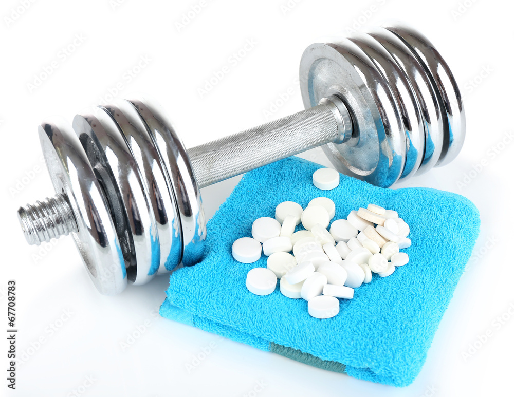 Dumbbell and tablets, isolated on white