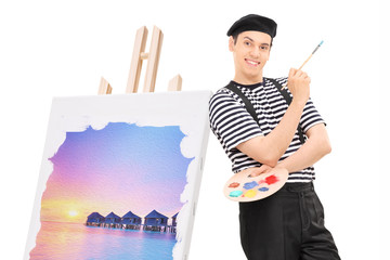 Poster - Male artist standing by a painting on an easel