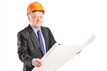 Poster - Mature architect looking at a construction plan