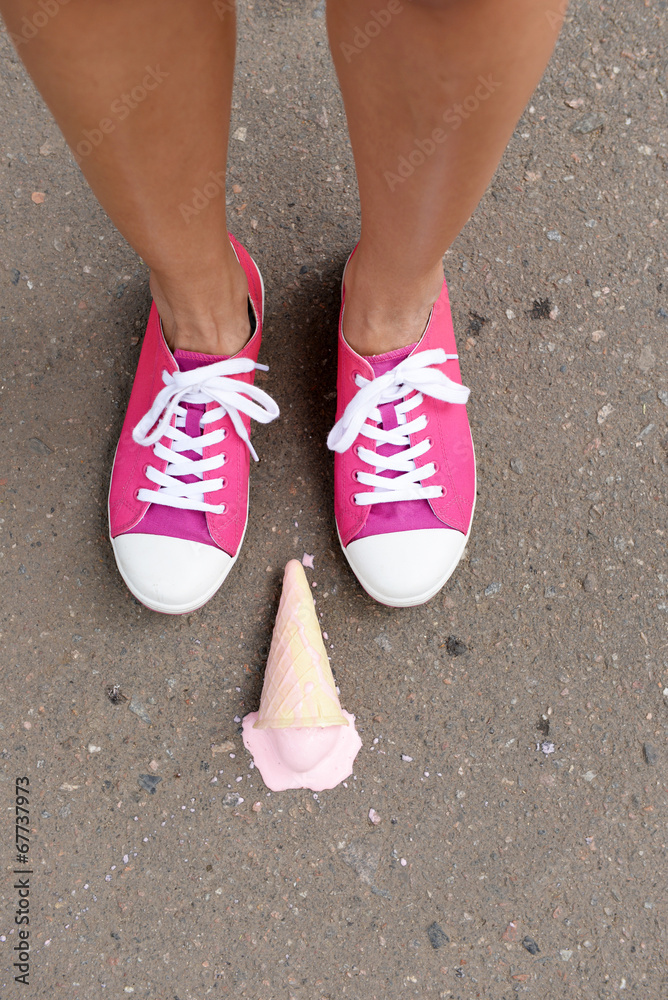 Ice cream fell on asphalt top view