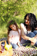 © Africa Studio - Happy mom and daughter. Picnic in the green park